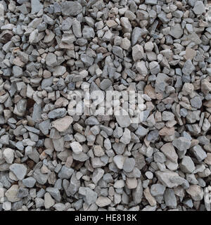 Abstrakt grau und Beige Kies Stein Hintergrund, graue Schotter und Granit Stücke Textur, große detaillierte horizontale textu Stockfoto