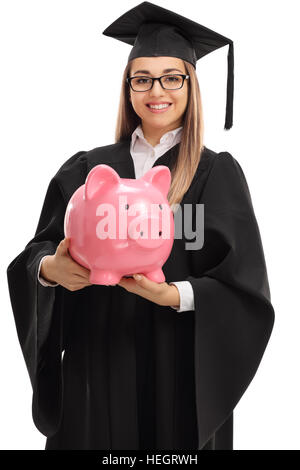 Glücklich graduate Studentin mit einem Sparschwein isoliert auf weißem Hintergrund Stockfoto