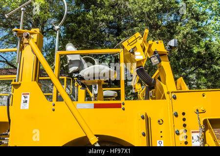 Road-Reparatur-Mechanismus. Stockfoto