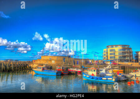 Boote West Bay harbour Dorset uk an einem schönen Tag mit blauem Himmel im Sommer bunte HDR Stockfoto
