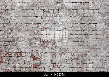 Eine Mauer gemalt Silber.  Lack-Chips haben abgeschält enthüllt die ursprüngliche Fläche unten. Stockfoto
