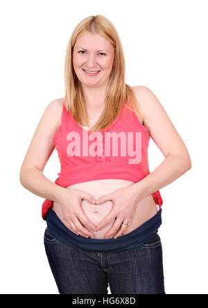 Schwangere Frau macht Herz am Bauch unterzeichnen Stockfoto