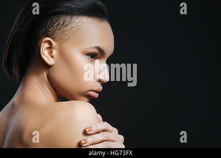 Gut aussehende schöne Frau, halbe Gesicht Stockfoto