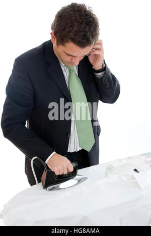 Geschäftsmann macht Bügeln Stockfoto