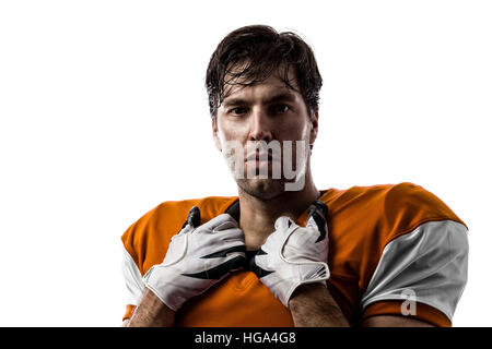 Football-Spieler mit einem Orange uniform auf einem weißen Hintergrund. Stockfoto