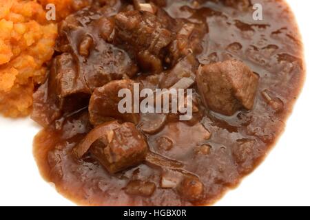 Stücke von Rind in Soße Nahaufnahme Makro Bild Stockfoto