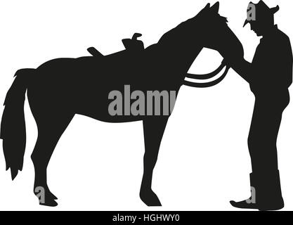 Im Gespräch mit seinem Pferd Silhouette Cowboy Stockfoto