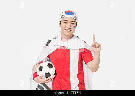 Porträt der jungen koreanischen Cheerleader Mann lächelnd Stockfoto
