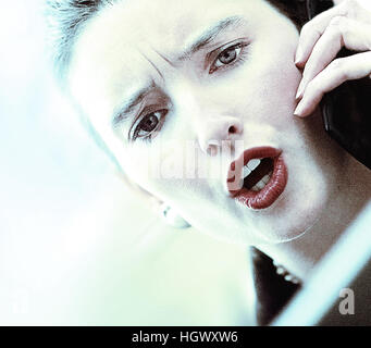 Geschäftsfrau auf Mobiltelefonen Stockfoto