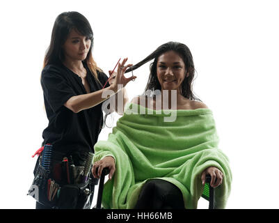 Frau und Friseur in der Silhouette auf weißem Hintergrund Stockfoto