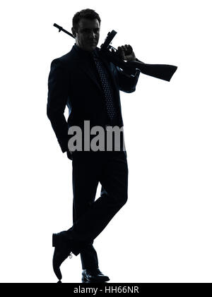 ein Mann hält Thompson Maschinengewehr in der Silhouette auf weißem Hintergrund