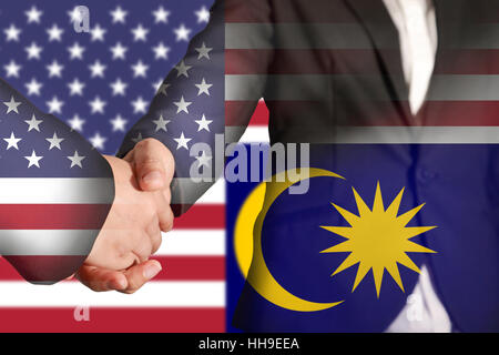 Doppelbelichtung Handshake auf Flagge USA und Malaysia Stockfoto