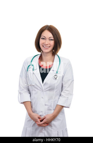 Schöne Frau Doktor lächelnd. Weiter hängt es ein Stethoskop. Das Mädchen ist völlig isoliert auf weißem Hintergrund. Stockfoto