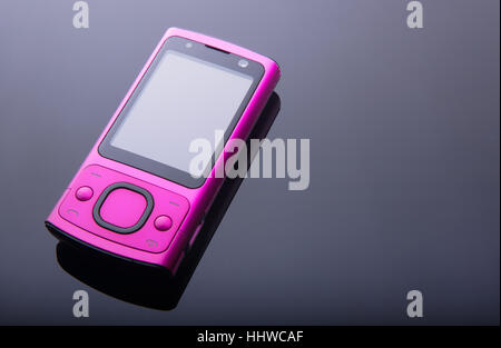Alt rosa Handy auf Verlaufshintergrund Stockfoto