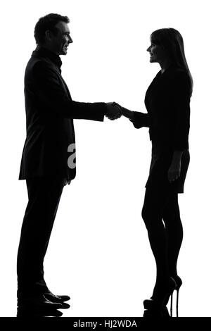 eine kaukasische paar Business Frau Mann Handshake Silhouette Studio isoliert auf weißem Hintergrund Stockfoto