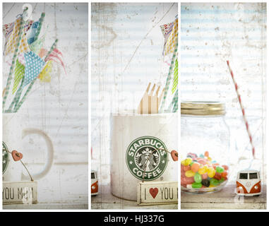 Weiß-Starbucks-Becher mit Starbucks-Logo, VW Camper Van, jellybeans auf weißem Holz Hintergrund. Stockfoto