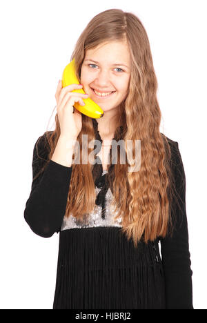 Mädchen halten frische Banane isoliert auf weiss Stockfoto