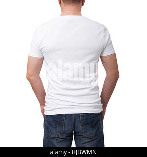 Mann trägt T-shirt leer auf grauen Ziegel Wand Hintergrund mit Textfreiraum. T-Shirt Design und Menschen Konzept - Großaufnahme der Mann im weißen T-shirt leer. Ansicht von hinten Stockfoto