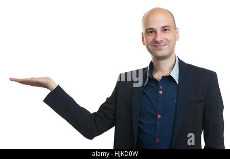 Geschäftsmann präsentiert etwas in seiner Hand. Isoliert auf weiss Stockfoto