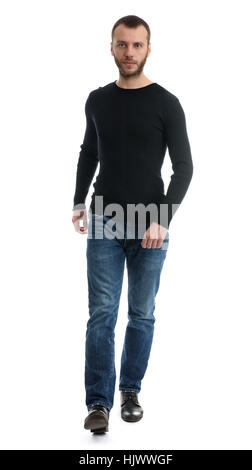 in voller Länge Portrait von lässig junger Mann zu Fuß in Richtung der Kamera über einen weißen Hintergrund isoliert Stockfoto