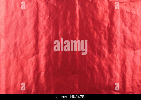 Abstrakte hellrot glänzend gefaltet Papierhintergrund Textur. Stockfoto