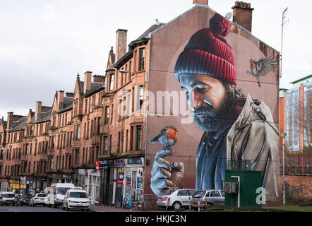 Spektakuläre Wandbild an der Giebelseite in High Street Glasgow. Das Wandbild zeigt eine moderne St Mungo - Schutzpatron von Glasgow. Stockfoto