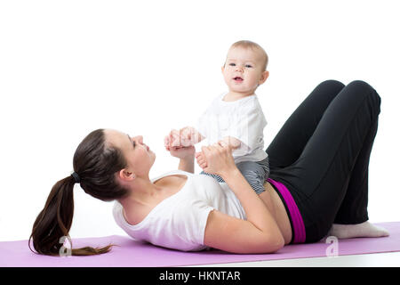 glückliche Mutter und Baby machen gesunde Fitness-Übungen Stockfoto