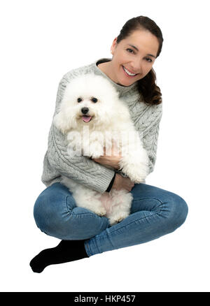 Frau mit Hund Bichon Frise isoliert auf weiß. Stockfoto