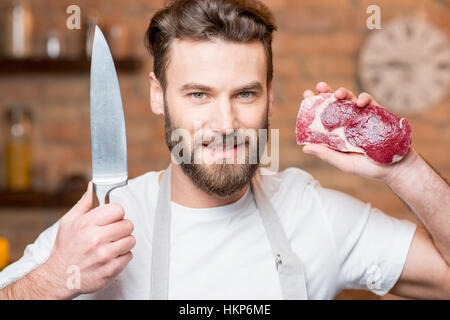 Mann mit Fleisch Stockfoto