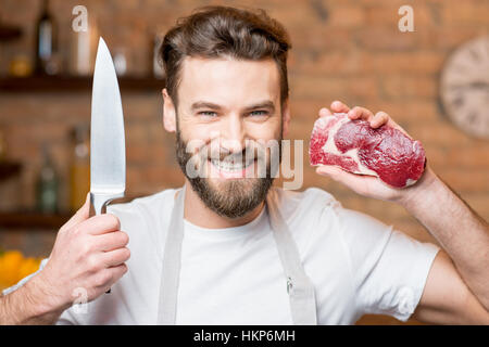 Mann mit Fleisch Stockfoto