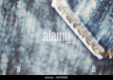 Retro-Farbe getönt nahe Bild von Blue Jeansstoff, abstrakten Hintergrund unscharf. Stockfoto