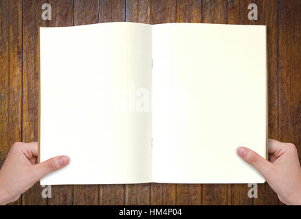 Hände halten Buch Stockfoto