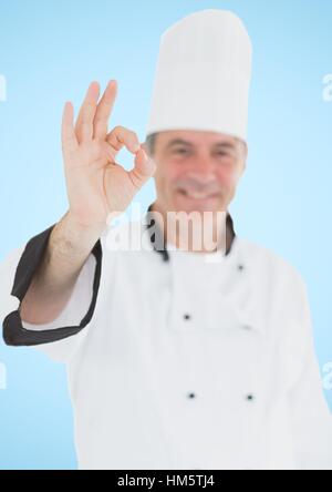 Porträt des Lächelns männlichen Chef Koch zeigt ok Sign. Stockfoto