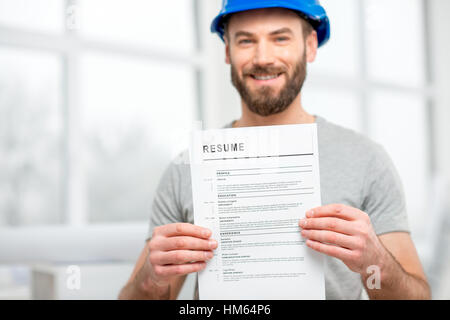Builder searching a job Stockfoto
