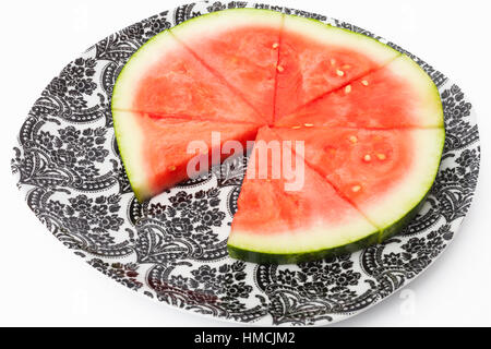 Wassermelone-Scheiben auf einen Teller, eine Scheibe fehlt Stockfoto