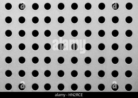 Metall Textur mit runden Löchern hautnah Stockfoto
