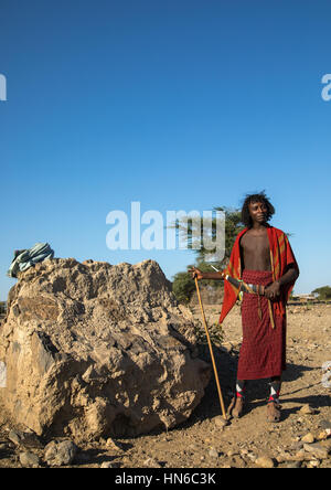 Porträt eines Afar Stammes Mannes mit seinem Messer Guile, Afar-Region, Chifra, Äthiopien Stockfoto