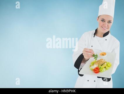 Digitalen Verbund von Koch mit Teller mit Essen vor blauem Hintergrund Stockfoto