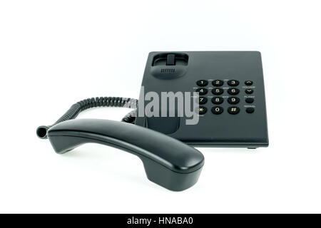 Schwarz Telefon mit Mobilteil in der Nähe auf dem weißen Hintergrund isoliert Stockfoto