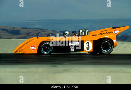 1960er Jahren verfolgen Denny Hulme kann bin Sport Rennwagen fahren in Laguna Seca Rennen 1987 Stockfoto