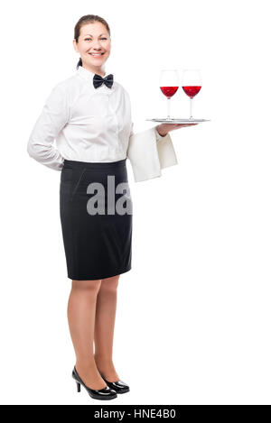 Brünette Frau arbeitet als Kellner, hielt ein Tablett mit Gläsern Wein isoliert in einem studio Stockfoto