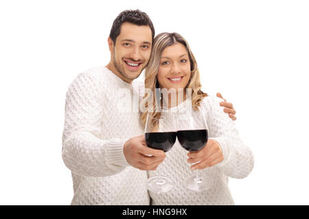 Freudige junges Paar macht einen Toast mit Gläser Wein isoliert auf weißem Hintergrund Stockfoto