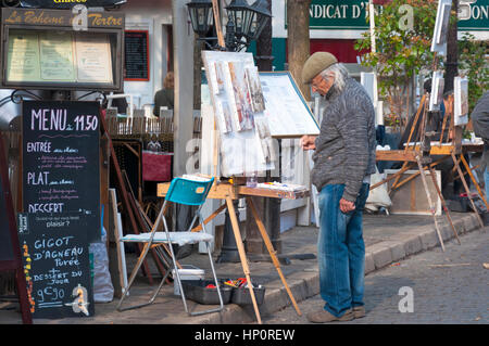 Ein Künstler-Maler bei der Arbeit in Place du Tertre, 18. Arrondissement Paris, Montmartre, Frankreich Stockfoto