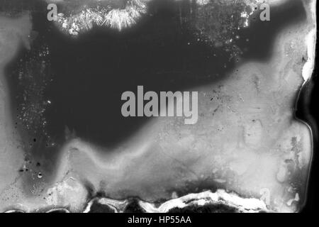 Abstrakte körnigen Schwarzweißfilm Streifen Textur. Enthält Getreide, Staub und Licht austritt. Stockfoto