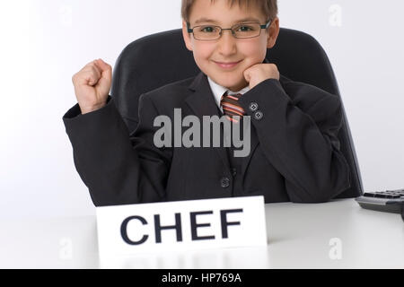 Model Release, Symbolbild Juniorchef Jubelt - symbolisch für Juniorchef Stockfoto
