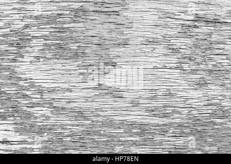 Nahaufnahme eines gerissenen und verwitterten Sperrholz Textur Hintergrund mit Lack abgeblättert in schwarz & weiß. Stockfoto