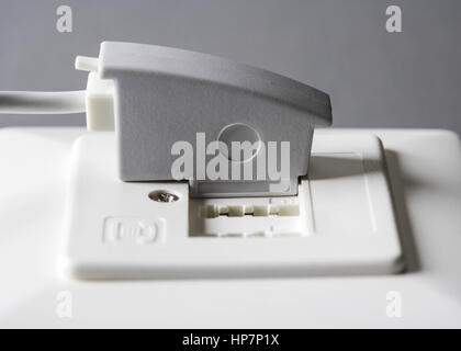 Tae-Stecker in telefonanschlussbuchse Stockfoto