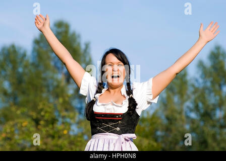 Model Release, Junge, Froehliche Frau Im Dirndl - junge, glückliche Frau im dirndl Stockfoto