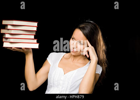 Junge Frau Mit Buchstapel - Frau mit Stapel Bücher, Modell veröffentlicht Stockfoto