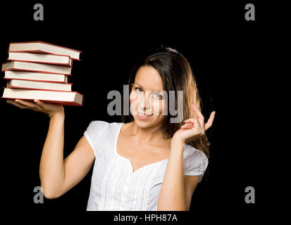 Junge Frau Mit Buchstapel - Frau mit Stapel Bücher, Modell veröffentlicht Stockfoto